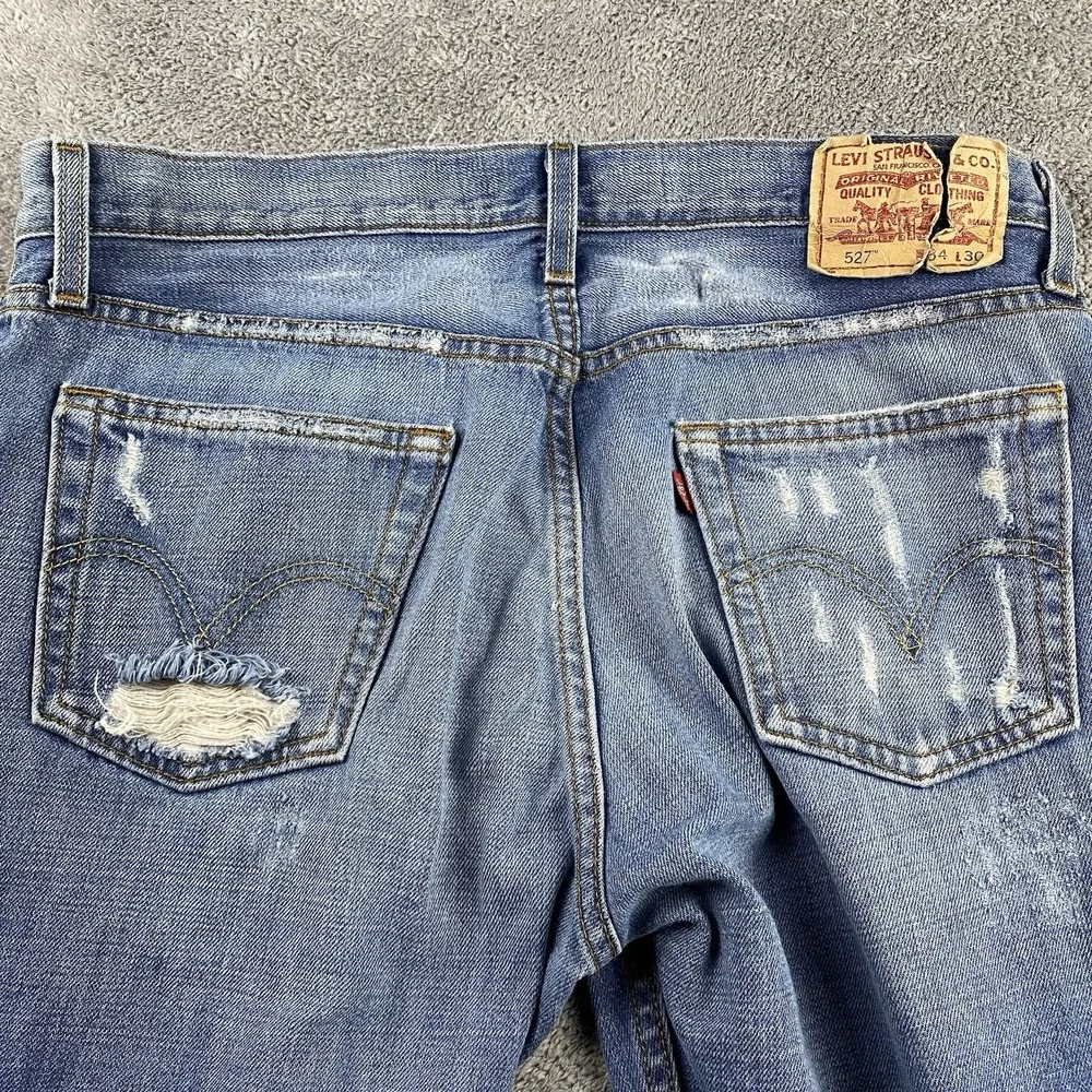 Levis 527 Low Boot Cut Jeans Mens 34x30 Blue Medium Wash Mid Rise Distressed Rip
